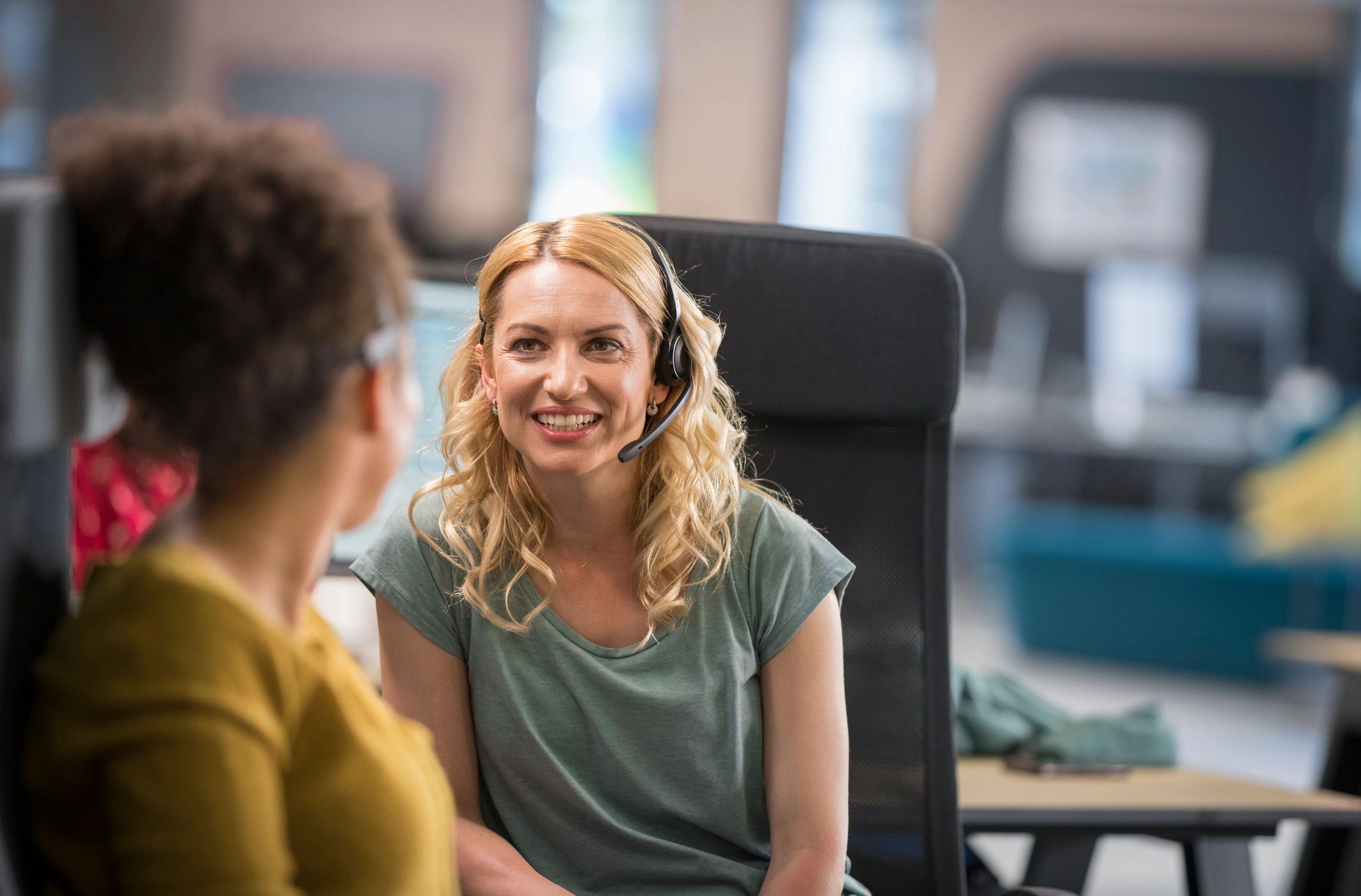 Customer support team collaborating in a call center