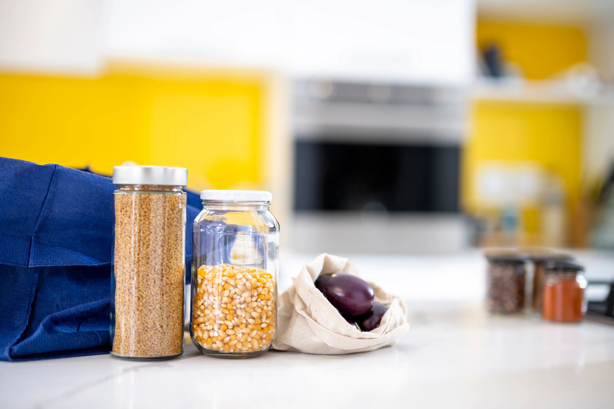 Glass jars and reusable storage bags for pantry organization