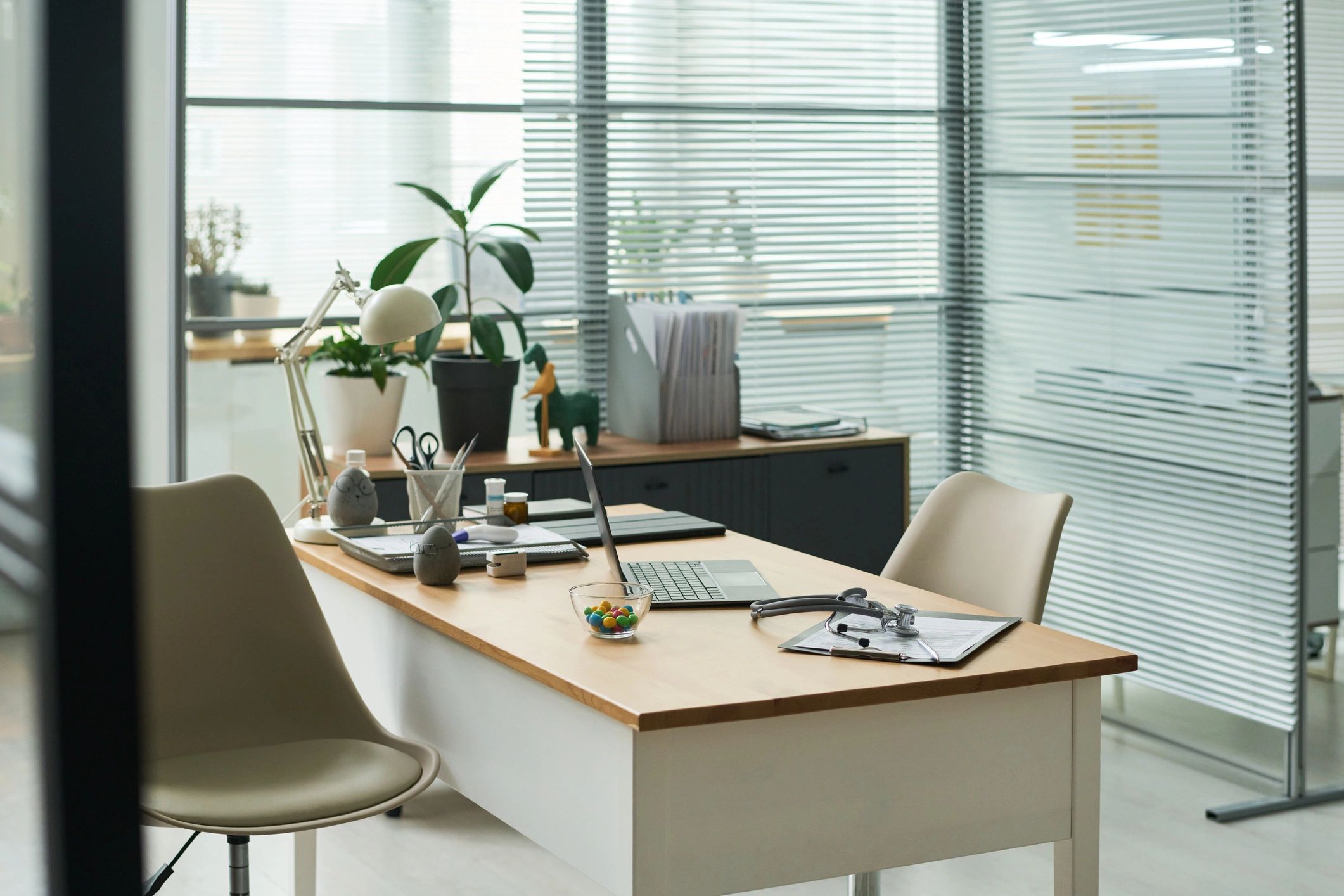 Professional desk workspace with laptop and documents